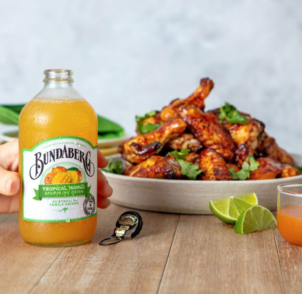 Bundaberg tropical mango sparkling drink with chicken wings