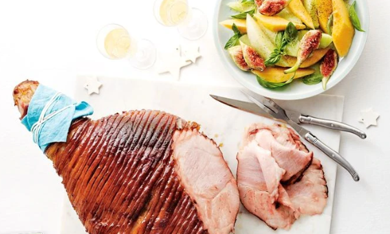 Christmas ham served with sliced fruit